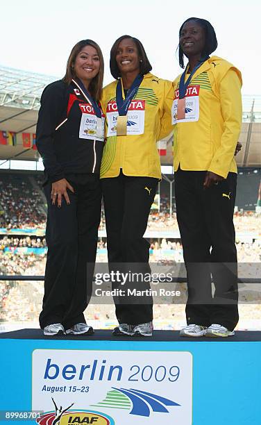 Priscilla Lopes-Schliep of Canada receives the silver medal, Brigitte Foster-Hylton of Jamaica the gold medal and Delloreen Ennis-London of Jamaica...