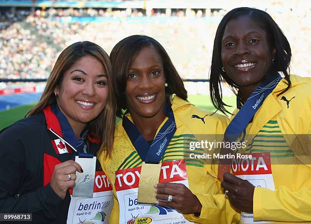 Priscilla Lopes-Schliep of Canada receives the silver medal, Brigitte Foster-Hylton of Jamaica the gold medal and Delloreen Ennis-London of Jamaica...