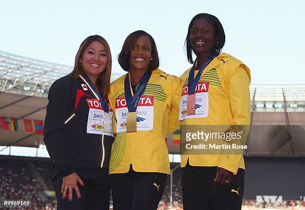 Priscilla Lopes-Schliep of Canada receives the silver medal, Brigitte Foster-Hylton of Jamaica the gold medal and Delloreen Ennis-London of Jamaica...
