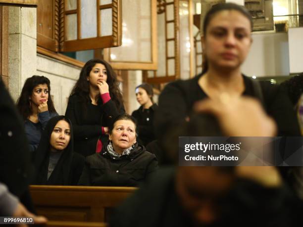 Relatives of victims of Egypt's Mar Mina church attack, mourn during their funeral service, at a church in Helwan, South-eastern Cairo, Egypt, 29...