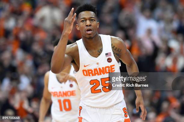 Tyus Battle of the Syracuse Orange reacts to a three-point basket against the Eastern Michigan Eagles during the first half at the Carrier Dome on...