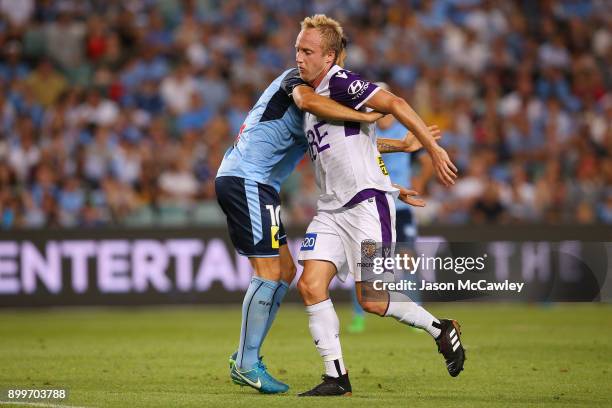 Mitch Nichols of the Glory is challenged by Milos Ninkovic of Sydney during the round 13 A-League match between Sydney FC and Perth Glory at Allianz...