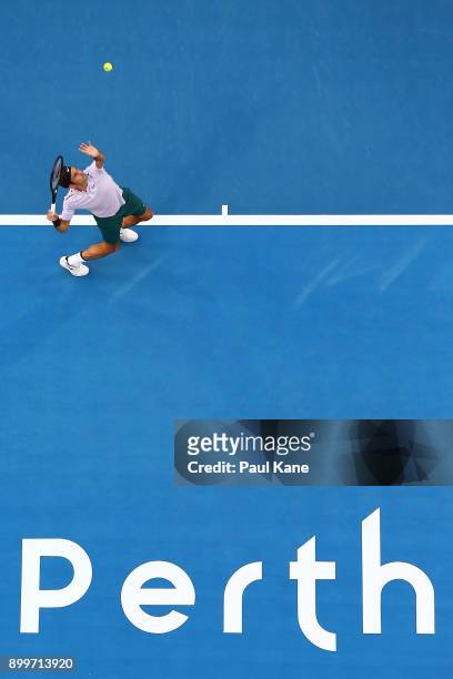 Roger Federer of Switzerland serves in his 2018 Hopman Cup match against Yuichi Sugita of Japan at Perth Arena on December 30, 2017 in Perth,...