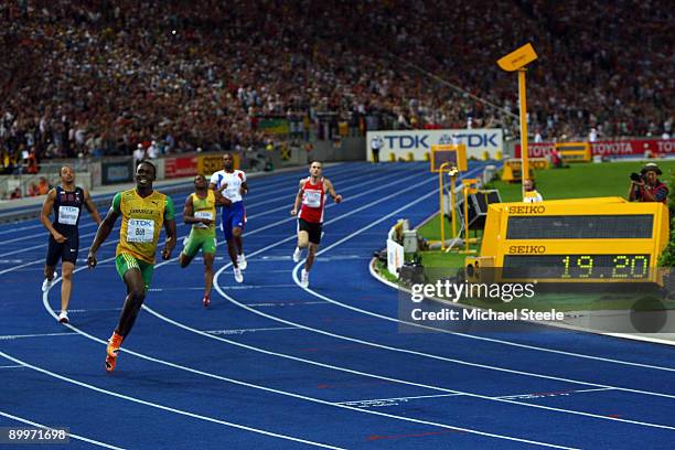 Usain Bolt of Jamaica crosses the line to win the gold medal in the men's 200 Metres Final during day six of the 12th IAAF World Athletics...