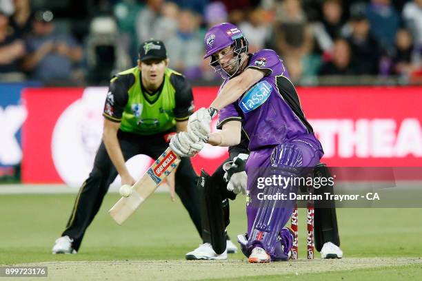 Alex Doolan of the Hobart Huuicanes hits the ball only to be caught in the outfield during the Big Bash League match between the Hobart Hurricanes...