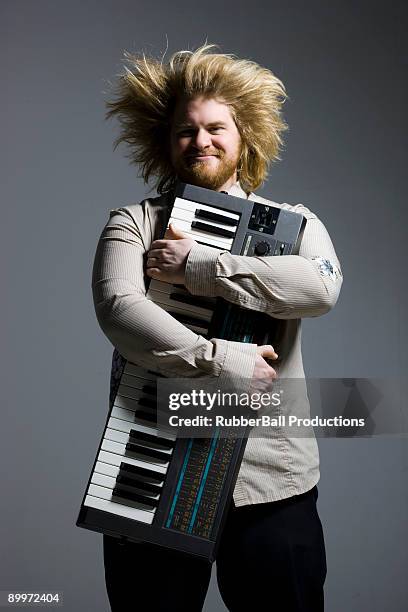 man holding a keyboard - hair standing on end stock pictures, royalty-free photos & images