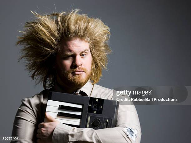 man holding a keyboard - hair standing on end stock pictures, royalty-free photos & images