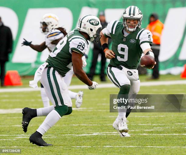 Quarterback Bryce Petty of the New York Jets hands off to teammate Bilal Powell in an NFL football game against the Los Angeles Chargers on December...