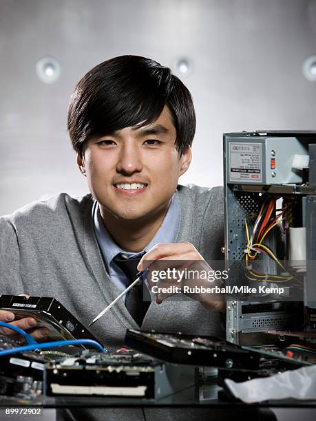 man working on a computer - disassembling stock pictures, royalty-free photos & images