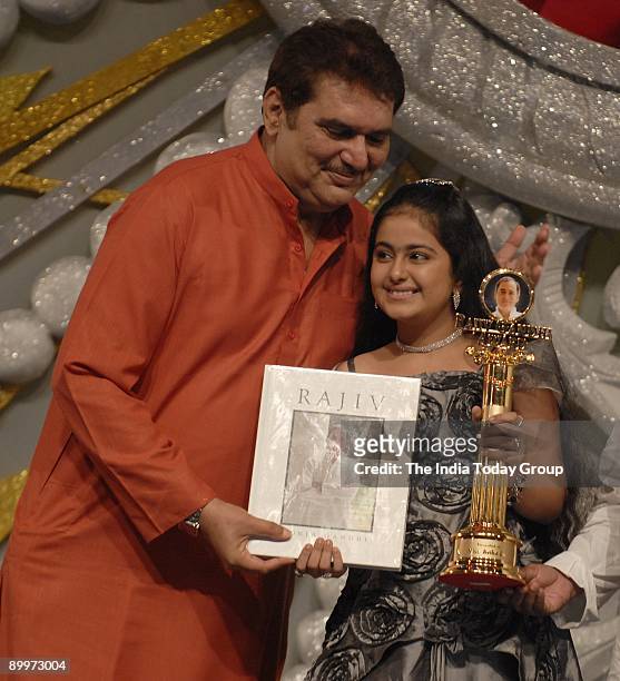 Actor Raza Murad gives Avika Gor of Balika Vadhu fame the award at the12th Rajiv Gandhi Awards function. The awards, organized by the youth wing of...