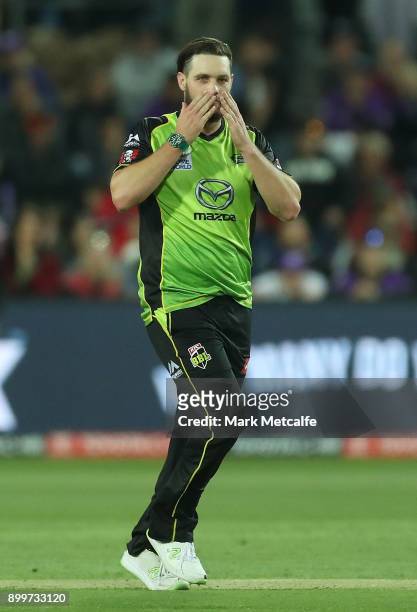 Mitchell McClenaghan of the Thunder celebrates taking ta wicket during the Big Bash League match between the Hobart Hurricanes and the Sydney Thunder...