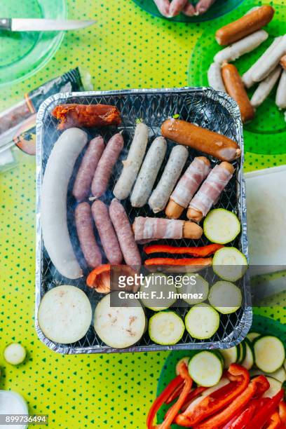 sausages and vegetable on barbecue - smokey bacon stock pictures, royalty-free photos & images