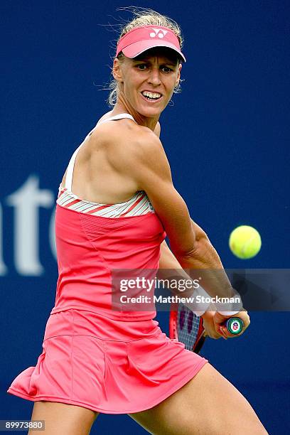 Elena Dementieva of Russia returns a shot to Shahar Peer of Israel during the Rogers Cup at the Rexall Center on August 20, in Toronto, Ontario,...