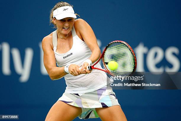 Shahar Peer of Israel returns a shot to Elena Dementieva of Russial during the Rogers Cup at the Rexall Center on August 20, in Toronto, Ontario,...