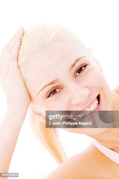 young blond woman smiling at us - philippe regard woman stock pictures, royalty-free photos & images
