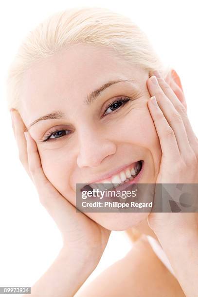 young blond woman smiling at us - philippe regard woman stock pictures, royalty-free photos & images