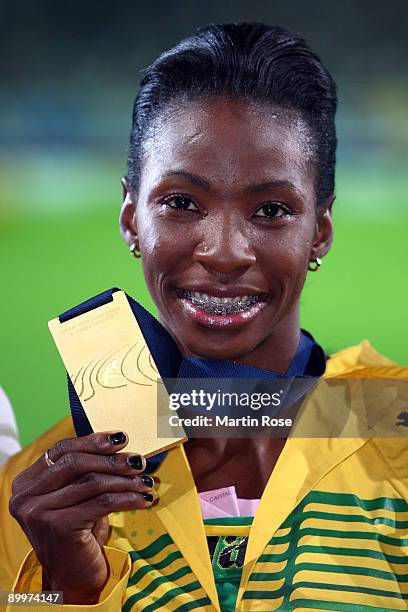 Melaine Walker of Jamaica receives the gold medal during the medal ceremony for the women's 400 Metres Hurdles Final during day six of the 12th IAAF...