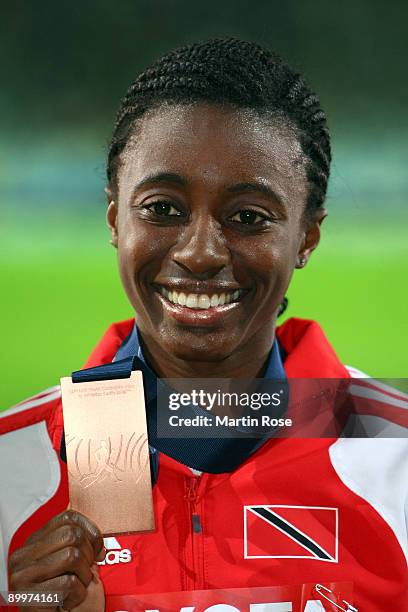 Josanne Lucas of Trinidad and Tobago receives the bronze medal during the medal ceremony for the women's 400 Metres Hurdles Final during day six of...