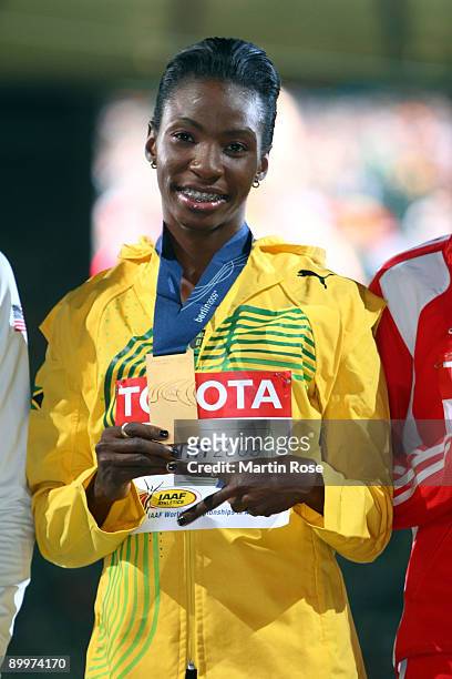 Melaine Walker of Jamaica receives the gold medal during the medal ceremony for the women's 400 Metres Hurdles Final during day six of the 12th IAAF...
