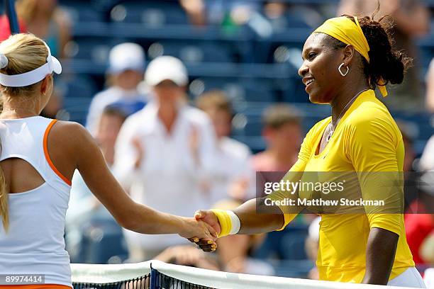 Alona Bondarenko of the Ukraine congrt Serena Williams of the United States after their match during the Rogers Cup at the Rexall Center on August...