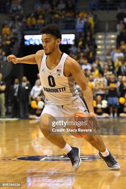 Markus Howard of the Marquette Golden Eagles handles the ball during a game against the Xavier Musketeers at the BMO Harris Bradley Center on...