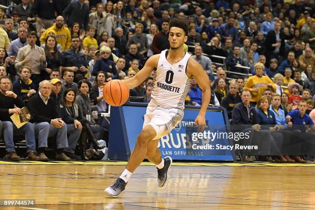 Markus Howard of the Marquette Golden Eagles handles the ball during a game against the Xavier Musketeers at the BMO Harris Bradley Center on...