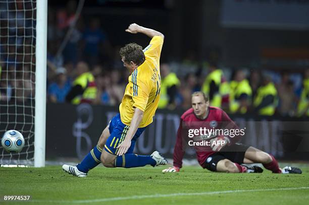 Keeper Jaroslav Drobny of Hertha Berlin is on the grass watching Morten Duncan Rasmussen missing a score during the UEFA Europa League play-off first...