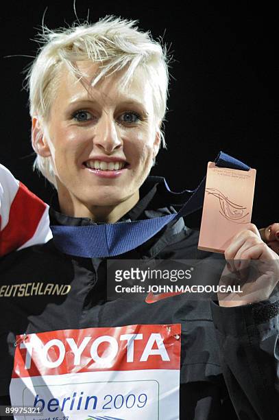Germany's Ariane Friedrich celebrates during the medal ceremony of the women's high jump final of the 2009 IAAF Athletics World Championships on...