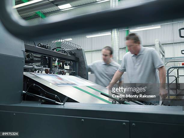 workers inspecting printer - paper industry stock pictures, royalty-free photos & images