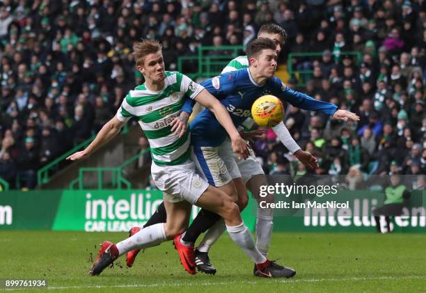 Josh Windass of Rangers is challenged by Stuart Armstrong of Celtic during the Scottish Premier League match between Celtic and Rangers at Celtic...