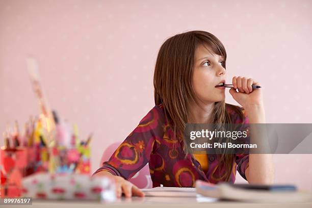 teenage girl doing homework - distracted stock pictures, royalty-free photos & images