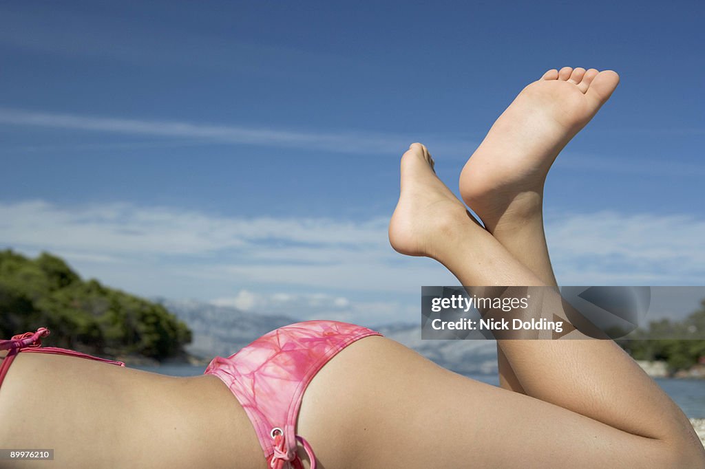 Girl laying on beach