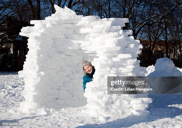 girl in igloo in the snow - igloo isolated stock pictures, royalty-free photos & images