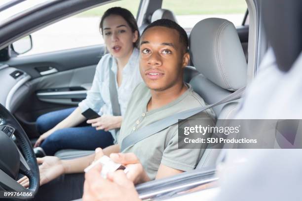 young man and woman are pulled over by the police - pulled over by police stock pictures, royalty-free photos & images