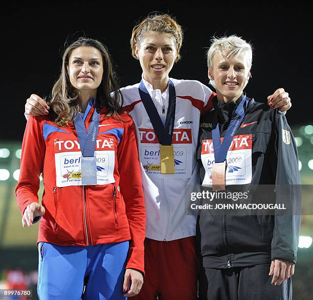 Russia's Anna Chicherova, Croatia's Blanka Vlasic and Germany's Ariane Friedrich celebrate during the medal ceremony of the women's high jump final...