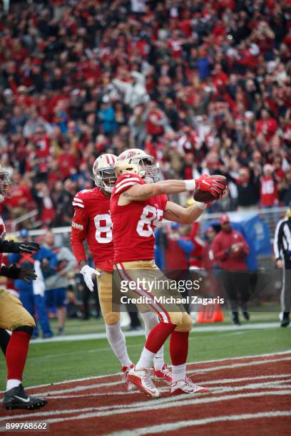 George Kittle of the San Francisco 49ers celebrates after socring on an 8-yard touchdown reception during the game against the Jacksonville Jaguars...
