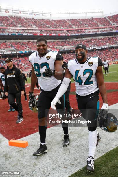 Calais Campbell and Barry Church of the Jacksonville Jaguars head to the locker room during halftime of the game against the San Francisco 49ers at...