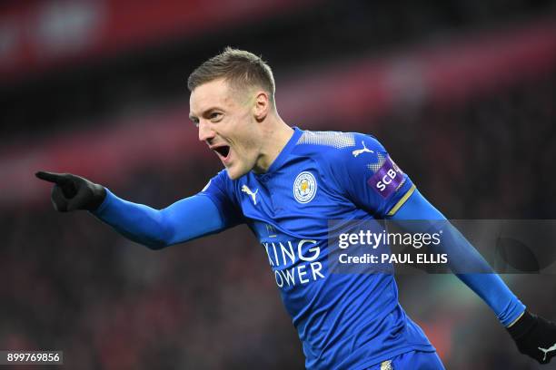 Leicester City's English striker Jamie Vardy celebrates scoring the team's first goal during the English Premier League football match between...