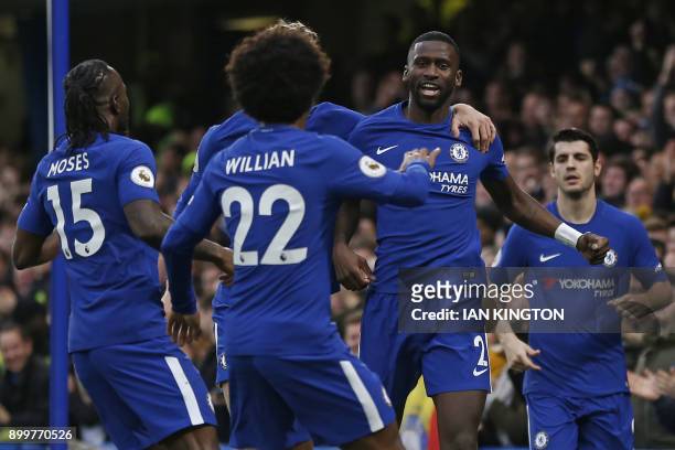 Chelsea's German defender Antonio Rudiger celebrates with teammates after scoring the opening goal of the English Premier League football match...