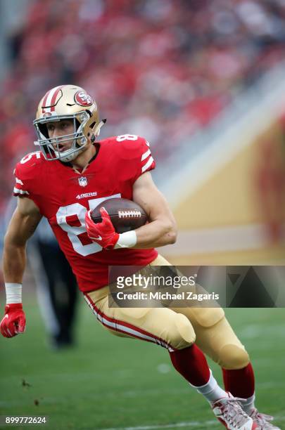 George Kittle of the San Francisco 49ers runs after making a reception during the game against the Jacksonville Jaguars at Levi's Stadium on December...