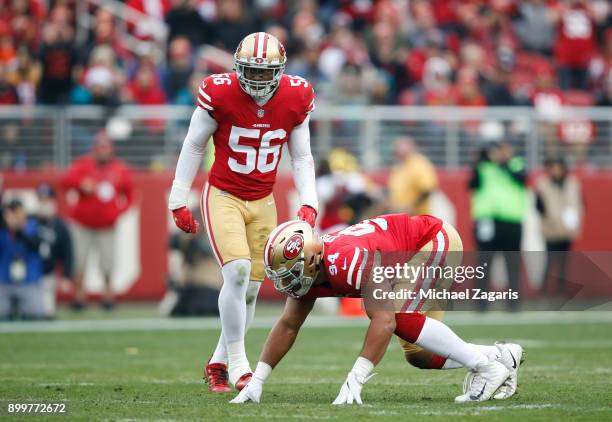 Reuben Foster and Solomon Thomas of the San Francisco 49ers defend during the game against the Jacksonville Jaguars at Levi's Stadium on December 24,...