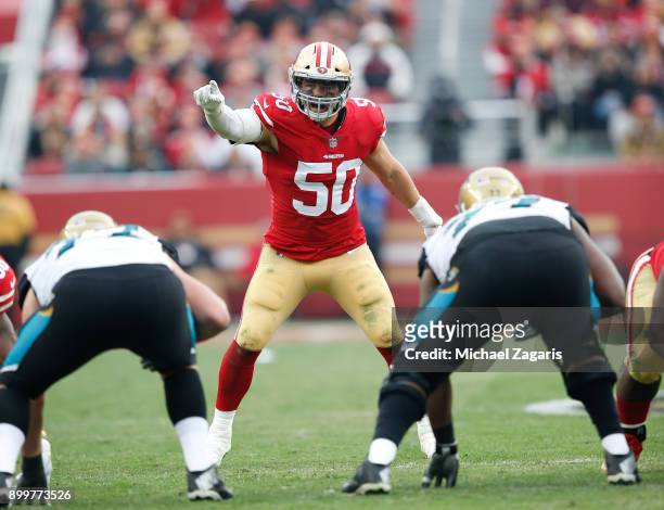 Brock Coyle of the San Francisco 49ers calls defensive signs during the game against the Jacksonville Jaguars at Levi's Stadium on December 24, 2017...