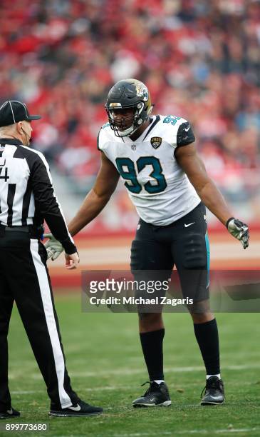 Calais Campbell of the Jacksonville Jaguars questions a call from Official Derick Bowers during the game against the San Francisco 49ers at Levi's...