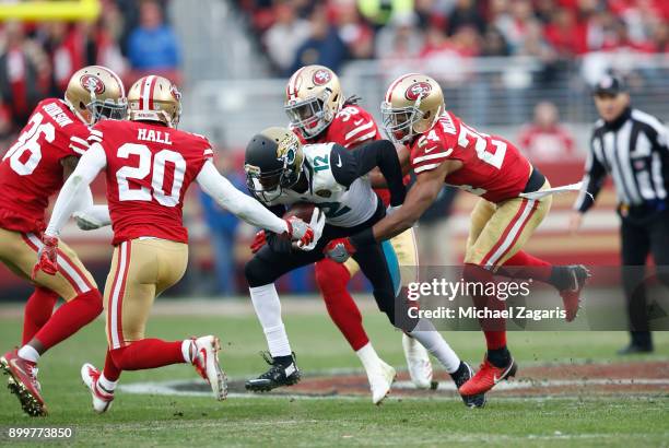 Dontae Johnson, Leon Hall, Dontae Johnson and K'Waun Williams of the San Francisco 49ers surround Dede Westbrook of the Jacksonville Jaguars, after a...