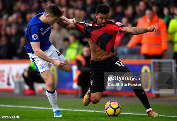 Joshua King of AFC Bournemouth and Jonjoe Kenny of Everton battle for the ball during the Premier League match between AFC Bournemouth and Everton at...