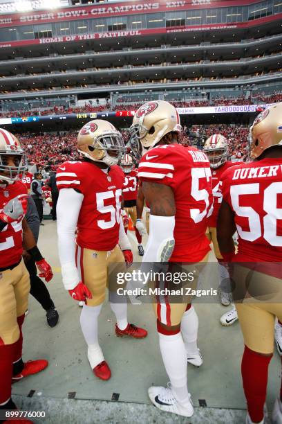 Eli Harold and Reuben Foster of the San Francisco 49ers fire each other up on the sideline during the game against the Jacksonville Jaguars at Levi's...