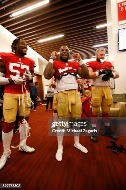 Eli Harold and Carlos Hyde of the San Francisco 49ers celebrate in the locker room following the game against the Jacksonville Jaguars at Levi's...