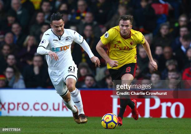 Roque Mesa of Swansea City and Tom Cleverley of Watford battle for possession during the Premier League match between Watford and Swansea City at...