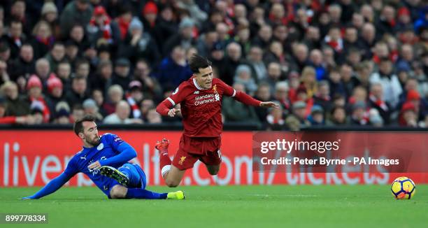 Leicester City's Christian Fuchs challenges Liverpool's Philippe Coutinho during the Premier League match at Anfield, Liverpool.