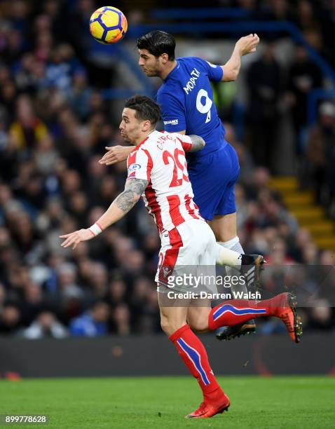 Alvaro Morata of Chelsea wins a header under pressure from Geoff Cameron of Stoke City during the Premier League match between Chelsea and Stoke City...